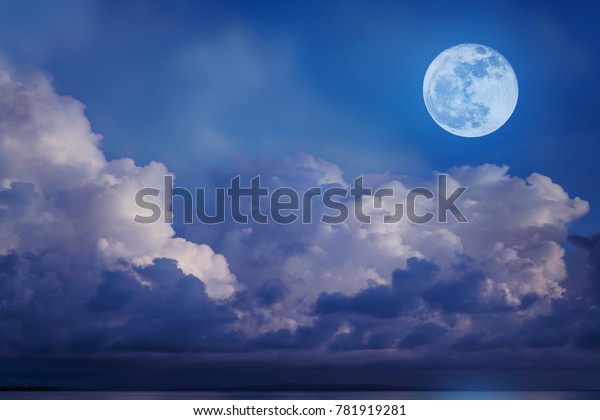 super moon in sea. attracive image of backgrounds\
night sky with cloudy and bright full moom. the moon was not\
furnished by NASA.