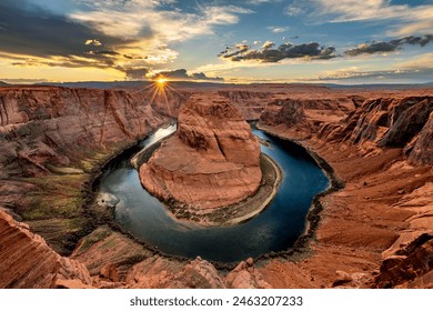 Super panorama of Horseshoe Bend in Page Arizona at sunset, showing a dramatic sky and the horseshoe shape from which the Colorado River flows. - Powered by Shutterstock