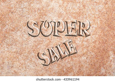  Super sale text on sandy soil background                    