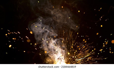 Super Slow Motion Of Flying Fire Sparkles. Detail Shot, Low Depth Of Focus.