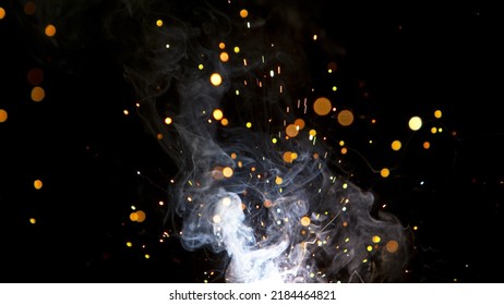 Super Slow Motion Of Flying Fire Sparkles. Detail Shot, Low Depth Of Focus.