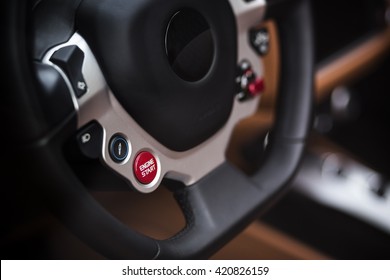 Super Sport Car Interior Detail On Red Engine Start Button On A Wheel