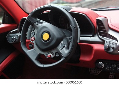 Super Sport Car Interior Detail On Red Engine Start Button On A Wheel. Red Car Interior