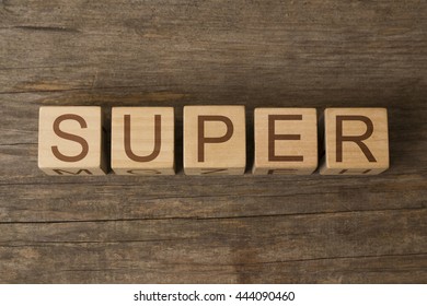 super word written on wooden cubes