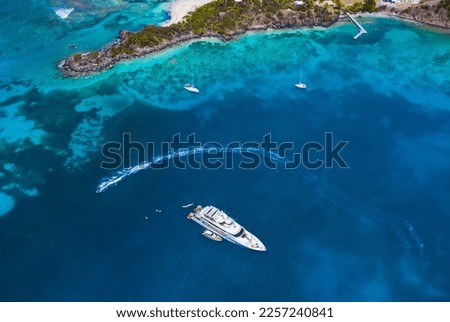 Super yacht anchored next to island