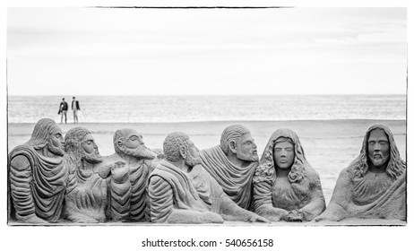 Superb black and white religious themed sand sculpture on the beach of Valencia, Spain