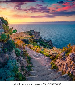 Superb spring dawn on Milazzo cape with olf staircase. Astonishing morning scene of Sicily, Italy, Europe. Amazing seascape of Mediterranean sea. Beauty of nature concept background.