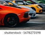 Supercars at the parking lot. Track day at the race track. Fast cars prepared for ride at the raceway. Cars and coffee meet 