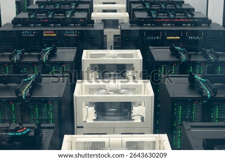 Supercomputer infrastructure inside modern data center with powerful server racks, cooling systems, and high-speed cabling.