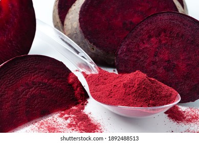 Superfood beetroot powder on a white background. Healthy eating concept dry beet powder. flour reduce blood pressure or boost energy and help detoxification