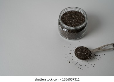 Superfood Chia Seeds Falling On White Background. Super Food Concept