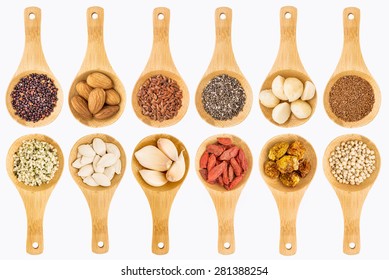 Superfood Grain, Seed, Berry, Nuts And Garlic Abstract - Top View Of Isolated On White Wooden Spoons (two Rows)