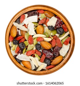 Superfood Snacking Mix In Wooden Bowl. Trail Mix Of Dried Almonds, Cranberries, Pepitas, Coconut Chips, Blueberries And Goji Berries. Closeup From Above On White Background, Isolated Macro Food Photo.