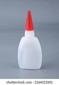 Superglue, Super Glue Bottle Isolated On Gray Background. For Fixing