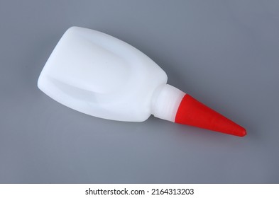 Superglue, Super Glue Bottle Isolated On Gray Background. For Fixing