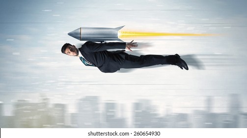 Superhero Business Man Flying With Jet Pack Rocket Above The City Concept