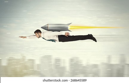 Superhero Business Man Flying With Jet Pack Rocket Above The City Concept