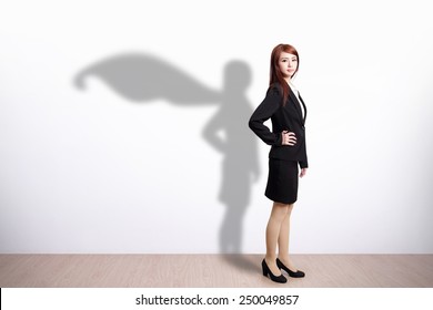 Superhero Business Woman with white wall background, great for your design or text, asian