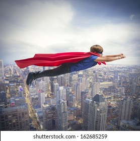 Superhero Kid Flying Fast Over The City