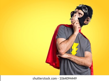 Superhero monkey man thinking