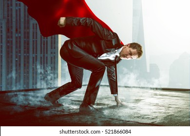 Superhero on a roof - Shutterstock ID 521866084