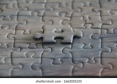 Superimposed Missing Piece Of A Jigsaw Puzzle. Concept Of Corporate Solutions, Strategy And  Finding The Right Fit For A Team.