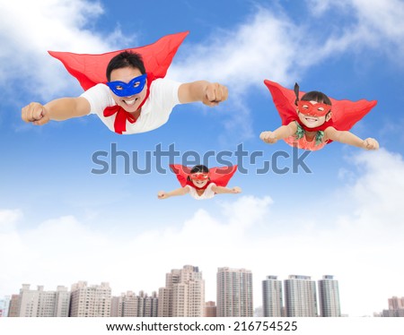 superman and daughters  flying in the sky with buildings background 