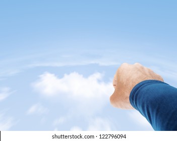 Superman Hand Flying In Cloudy Sky With Copy Space