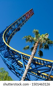 Superman Rollercoaster Ride In California Six Flags Magic Mountain In Front Of A Palm Tree