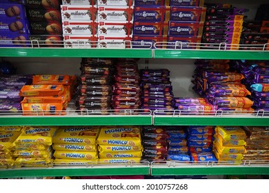 Supermarket Aisle Of Biscuits, Snacks, Cookies. Various Brand Biscuits Display On The Supermarket Aisle With Selective Focus. Shelves With Different Brands Of Biscuits. - Mumbai India May 2021