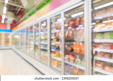 Supermarket Aisle With Commercial Refrigerators Freezer Showing Frozen Foods Abstract Blur Background