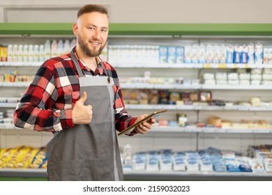 Supermarket Clerk Using Apps On A Digital Tablet, Innovative Technology And Work Concept, Close Up, Young Handsome Supervisor With Tablet Pc In The Mall. Retail Concept