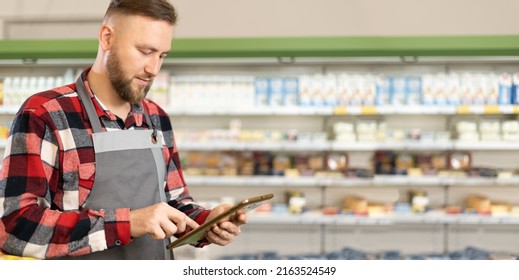 Supermarket Clerk Using Apps On A Digital Tablet, Young Handsome Supervisor With Tablet Pc In The Mall, Retail, Innovative Technology And Work Concept, Banner, Place For Text