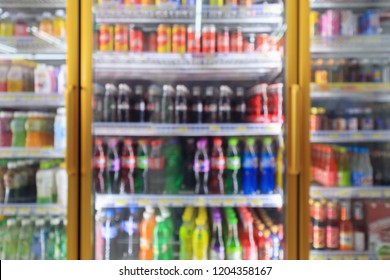 Supermarket Convenience Store Refrigerators With Soft Drink Bottles On Shelves Abstract Blur Background