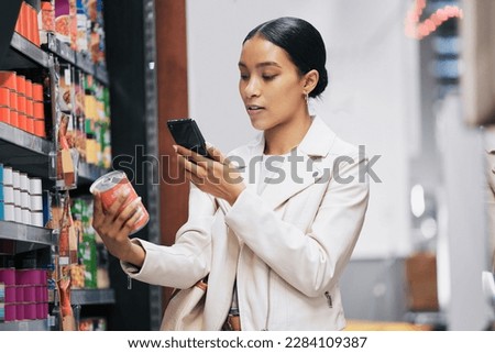 Supermarket, customer and price check on smartphone to compare product cost on ecommerce app. Grocery shop inflation and increase in spending money with essential lifestyle consumables. Stockfoto © 