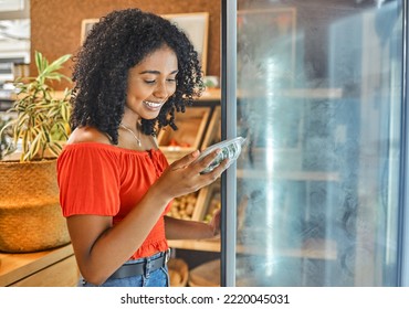 Supermarket, Grocery Store And Customer Black Woman Shopping For Healthy Food In Fridge Happy With Price Discount, Sale Or Promotion. Groceries, Small Business Store And Vegan Girl With Green Choice