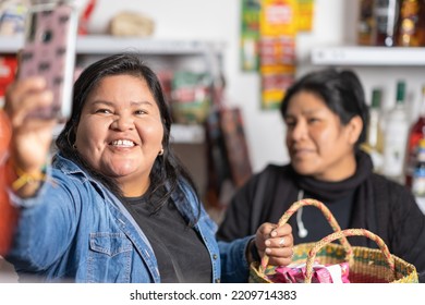 Supermarket Shopper And Cashier Taking A Selfie With A Mobile Phone Inside The Store