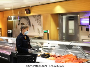 Supermarket Shopping, Face Mask And Gloves,Woman Shopping For Fresh Fish Seafood In Supermarket Retail Store	