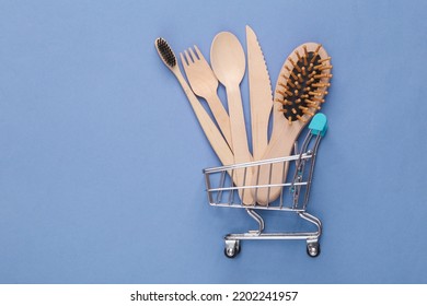 Supermarket Trolley With Eco Products On A Blue Background. Top View