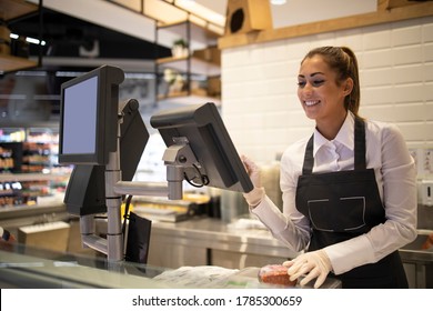 Supermarket Worker Measuring And Selling Meat To The Customer. Working In Grocery Store Meat Department.