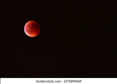 Supermoon Or Blood Moon In The Black Sky