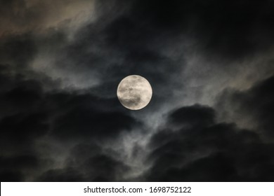 supermoon with some dark clouds