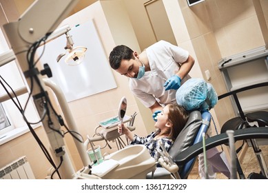 For A Superstar Smile. Kid At The Dental Office. Dentist Explains To His Patient How To Brush Teeth