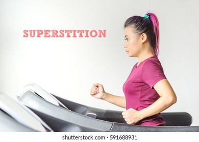 SUPERSTITION : Typed Words Over The Asian Athletics Women Inside The Gymnasium Fitness Centre With White Background. Conceptual Image For Sports, Training, Athlete And Fitness.