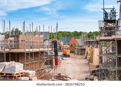 Superstructure brickwork and scaffolding on a modern residential housing development site