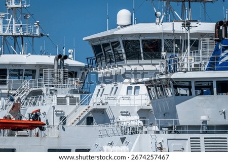 Superstructures of Three Ferries Docked alongside 
