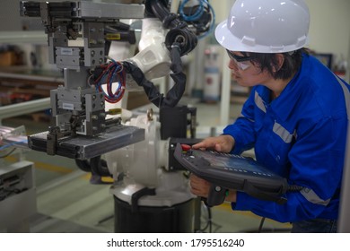 Supervisor Inspect Or Testing The System Of Robotic Brand New In Smart Factory Modern, Working Robotic Machinery Working Together With Human Control In Modern Factory