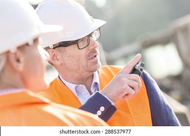 Supervisor Showing Something To Colleague At Construction Site