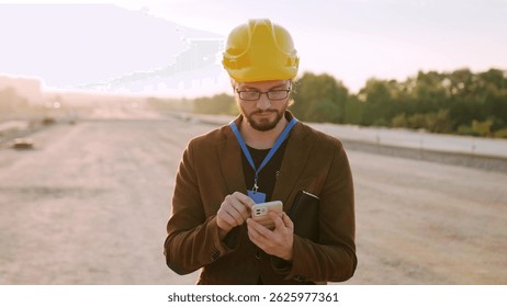 Supervisor using modern gadget for work at site