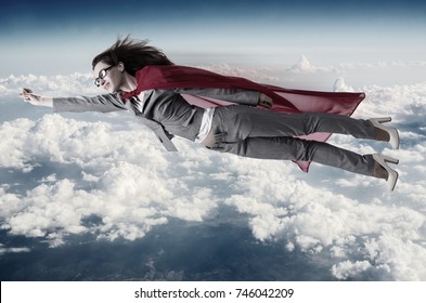 Superwoman Flying Above The Skies